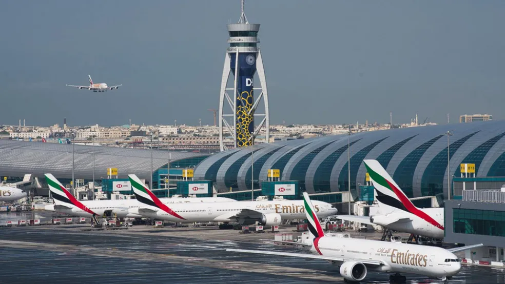 Dubai International Airport terminal and aircraft on the apron